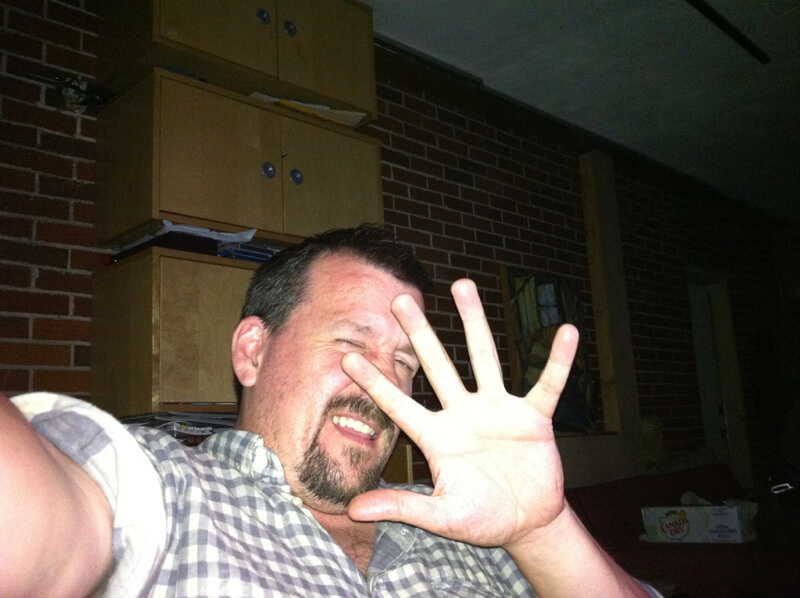 flash of iphone in guy’s face