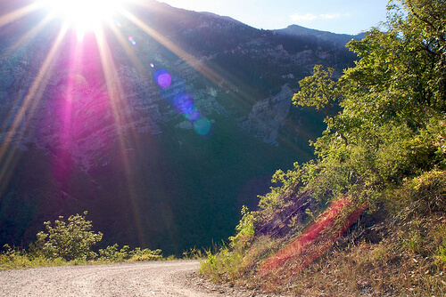 lens flare photography peeking over the sun lens flare photography peeking over the sun