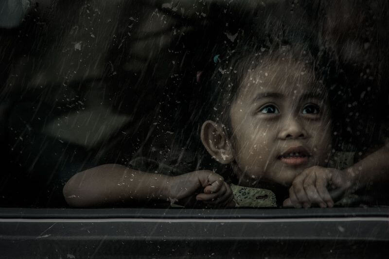 child by window