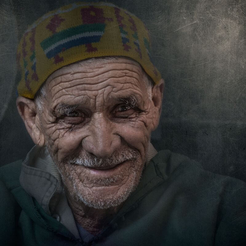 smiling man in hat