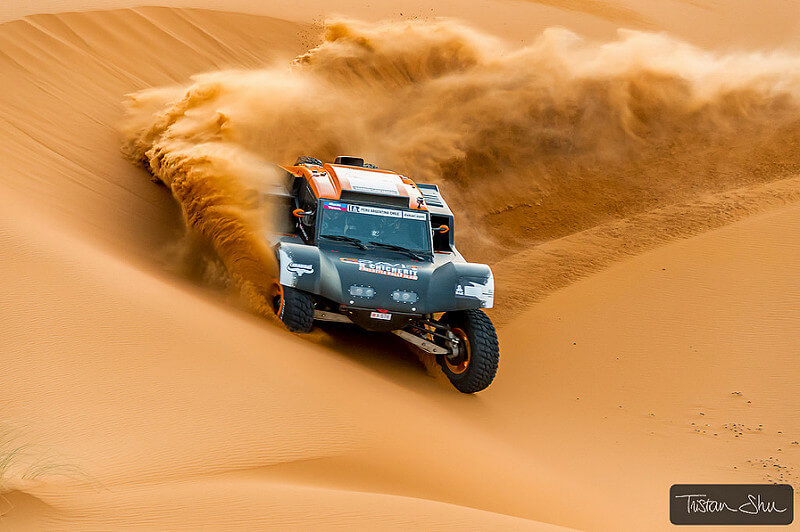 car racing through the Merzuga desert