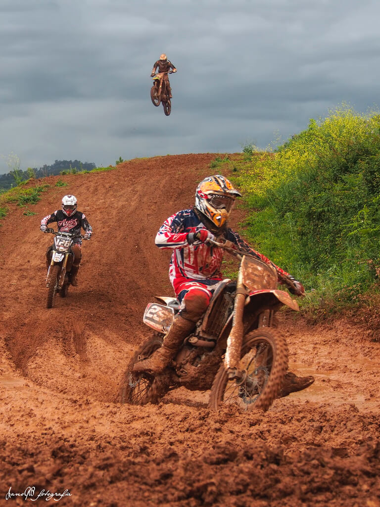 three motocross racers