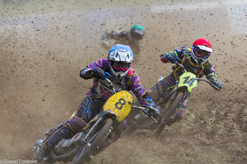 three motocross racers