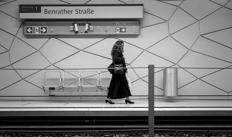 Woman walking in a metro station