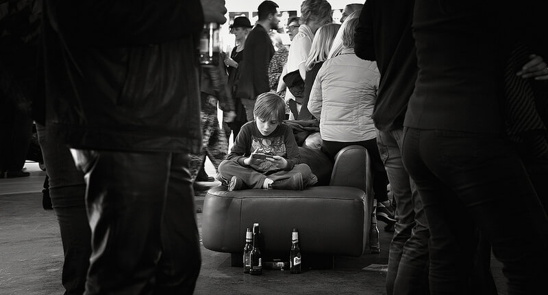boy sitting on a suitcase