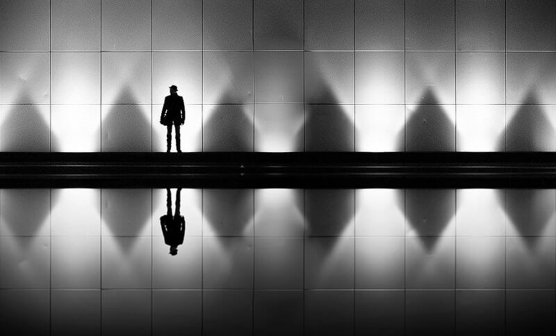 silhouette of a man with a hat
