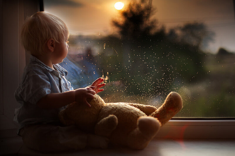 boy looking out window