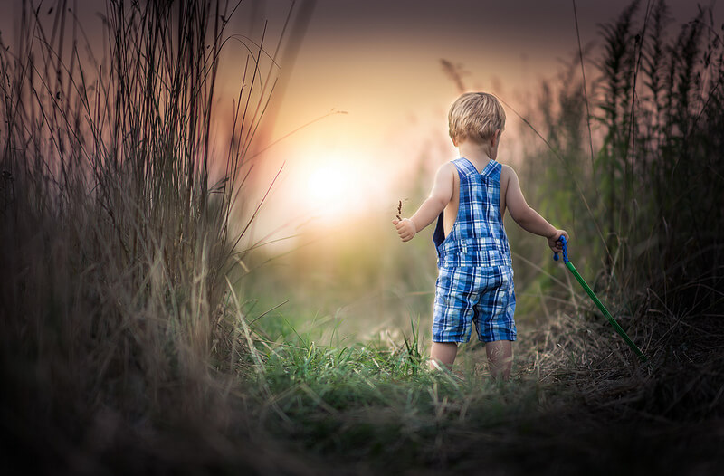 boy tall grass