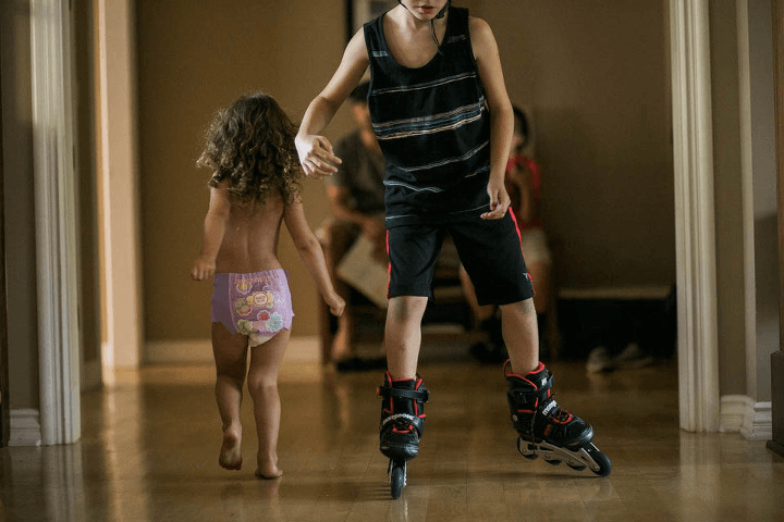 Kym Vitar kids running in house
