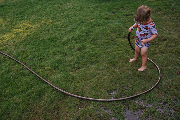 Chrystal Cienfuegos playing with hose