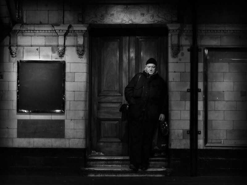 man in door frame