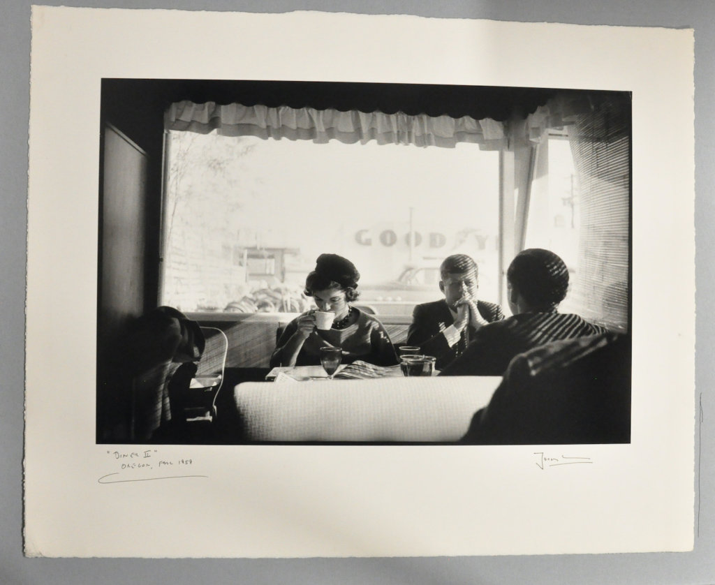 Sen. John F. Kennedy, Jacqueline Kennedy, and Stephen Smith (back facing camera) have a quiet Sunday morning breakfast after Mass while on the campaign trail in Oregon, 1959. This photo became one of Jacques Lowe’s most requested images. © The Estate of Jacques Lowe.