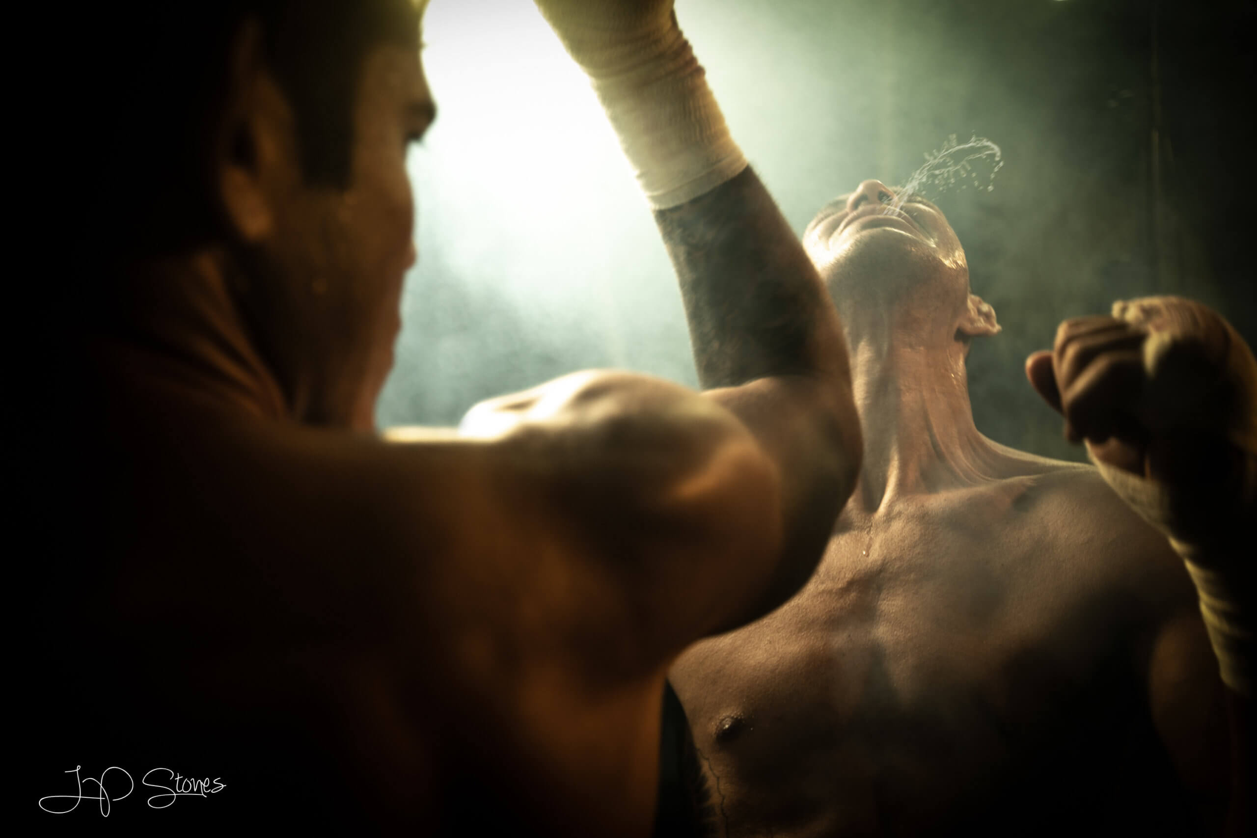 cinematic photography of boxer getting hit