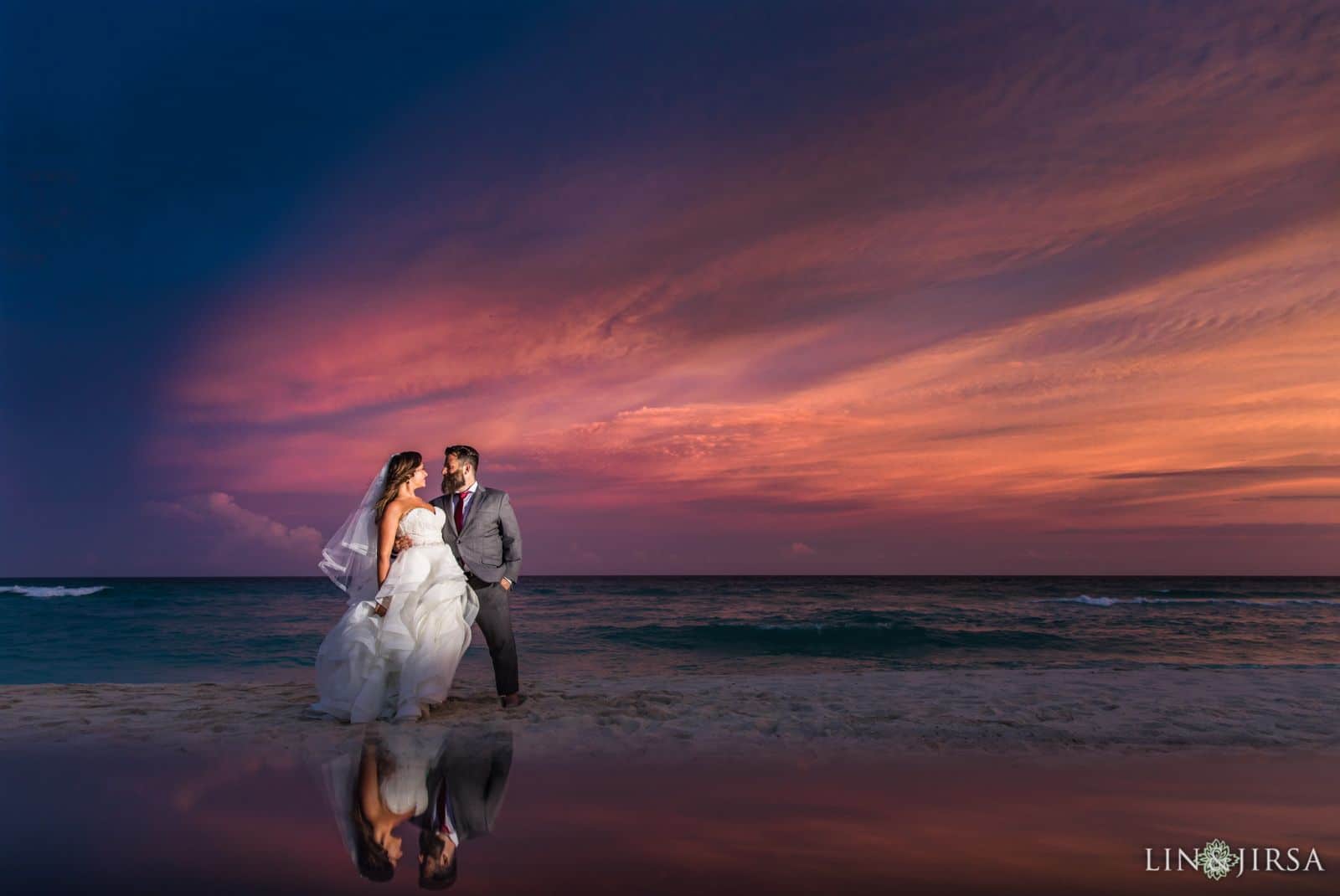 negative space photography couple reflected on beach at sunset