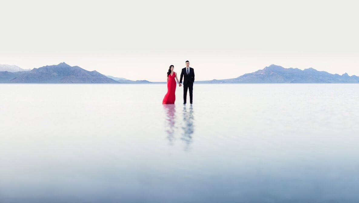 negative space photography couple in salt flats